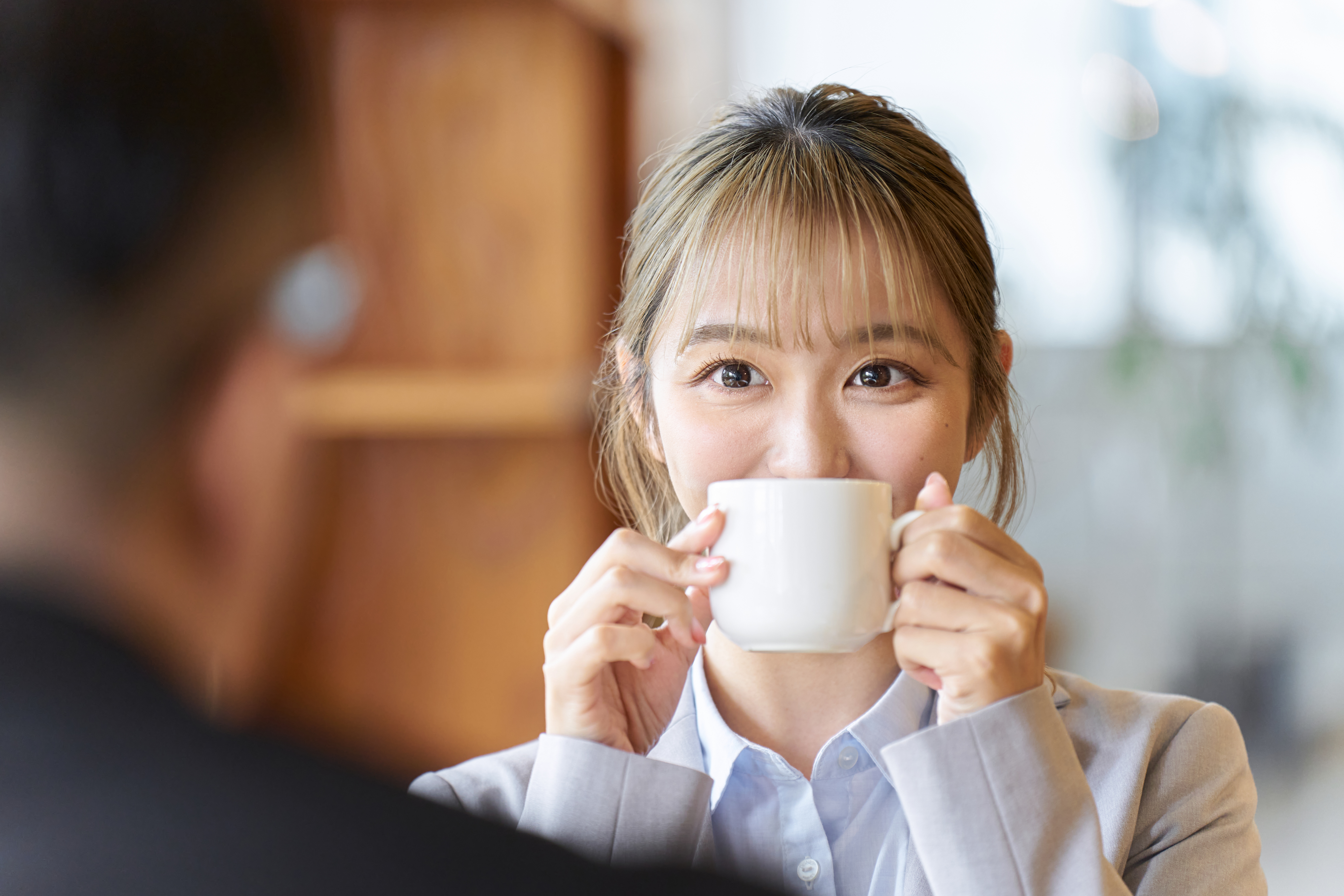 Asian woman having fun on a date at a cafe